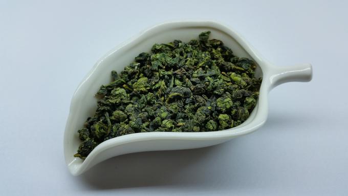 Laden Sie Tee Energie Tieguanyin Oolong, angebratene chinesische Tee-Bindung Guan Yin auf